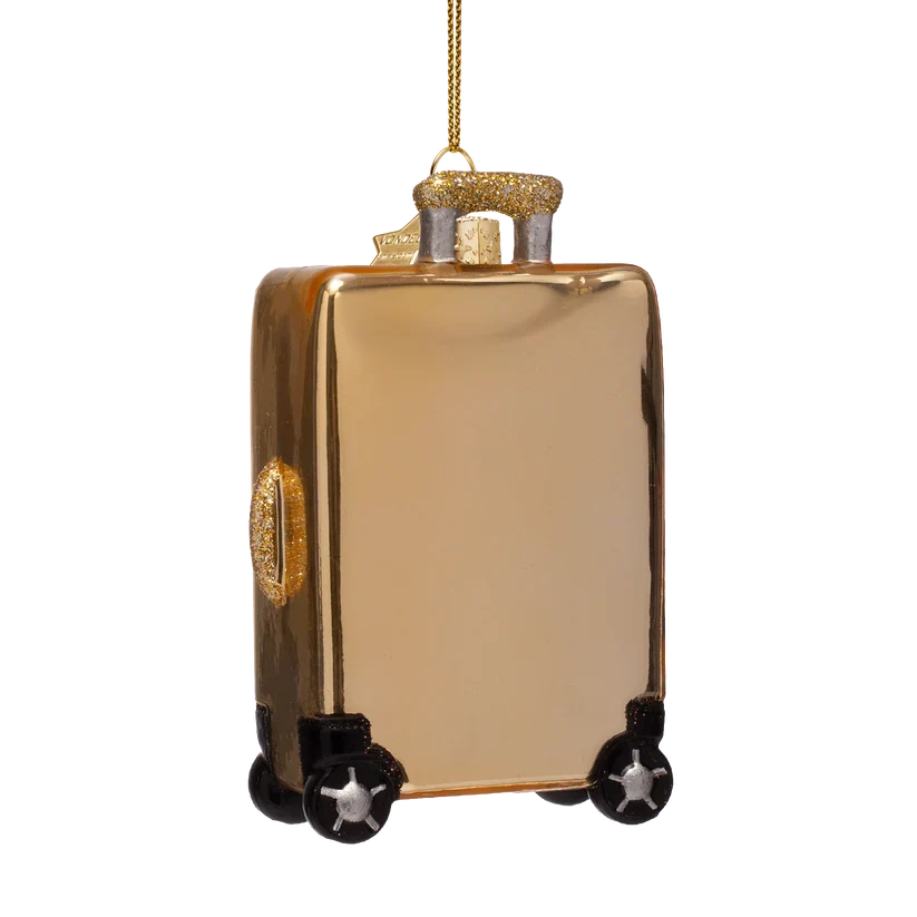 Vondels julekugle i guldfarvet glas formet som en kuffert med klistermærker