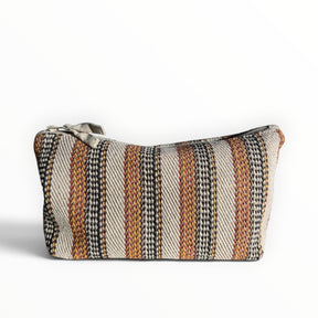 Himmerli kosmetiktaske i vævet tekstil med stribet mønster i beige, sort og brændt orange med lynlås